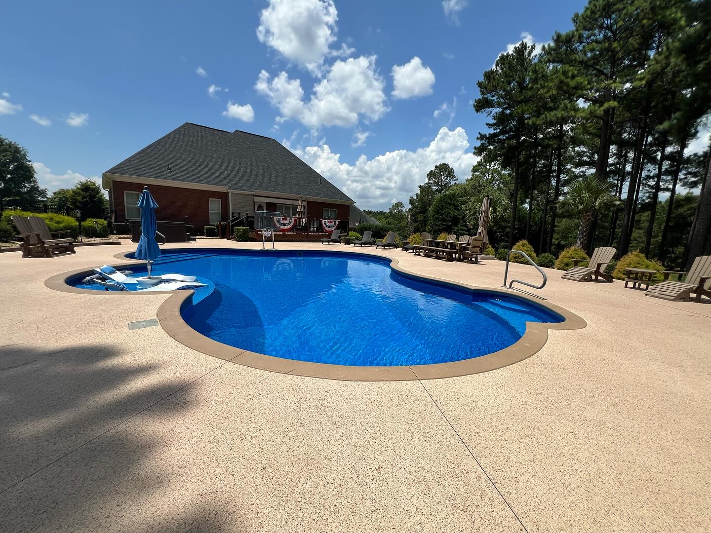 Freeform vinyl pool with stone deck
